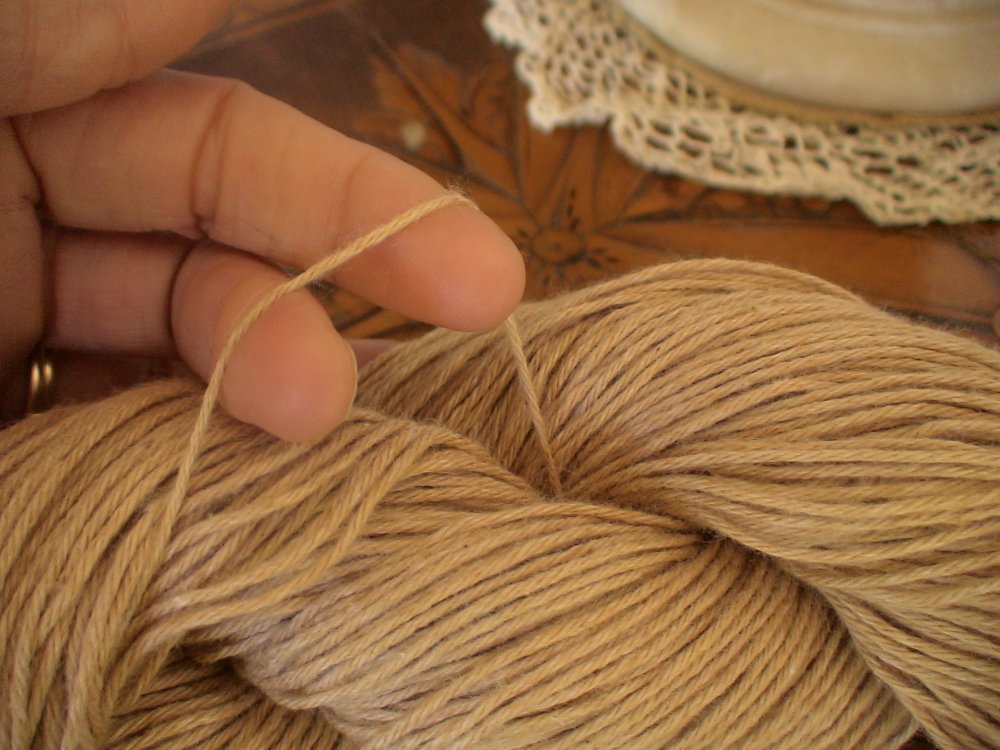 Strand of organic brown cotton yarn